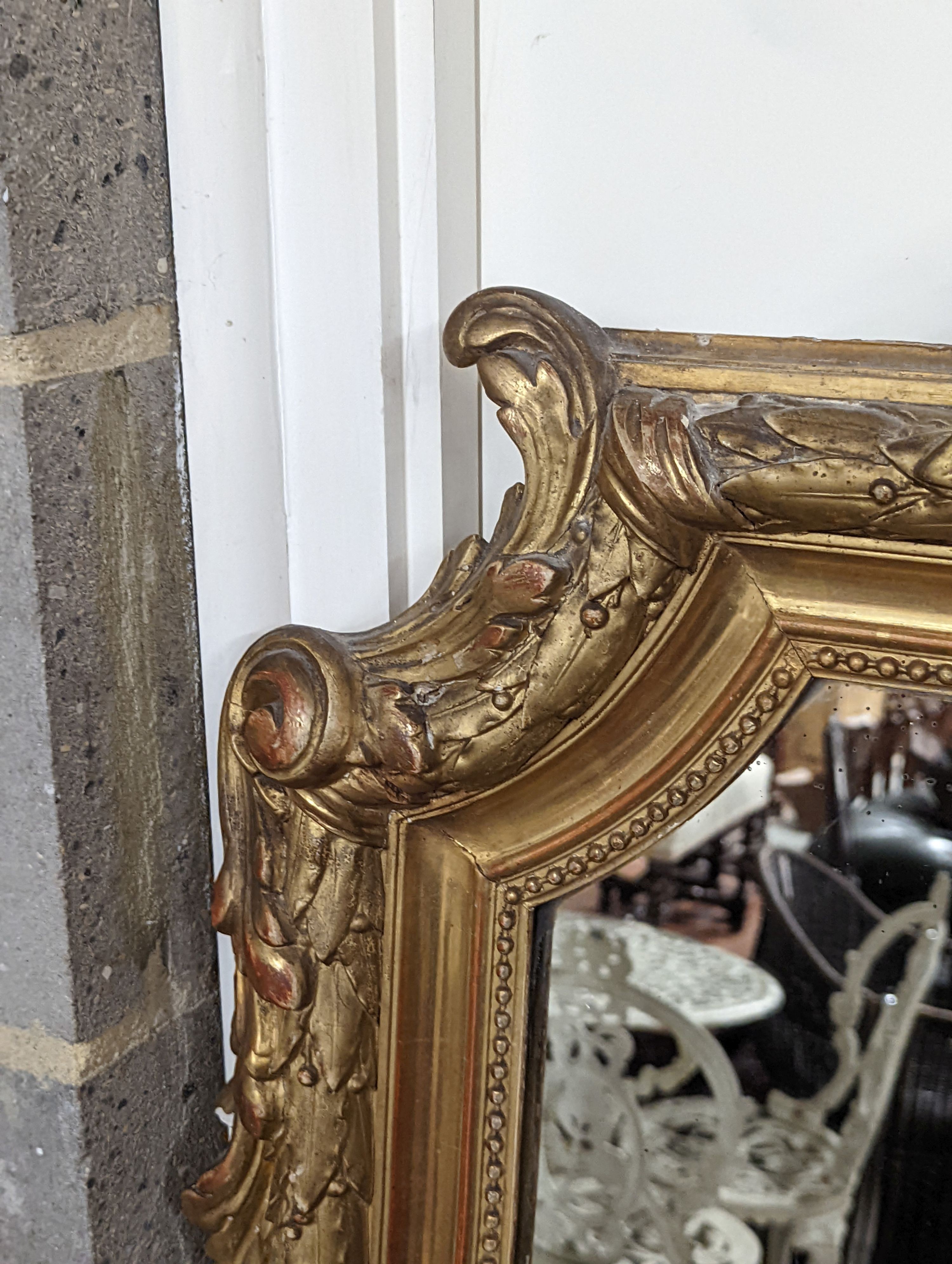 A 19th century French carved giltwood overmantel mirror, width 100cm, height 150cm